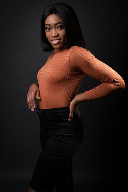 Free Woman Wearing Orange Long-sleeved Turtleneck Top Stock Photo