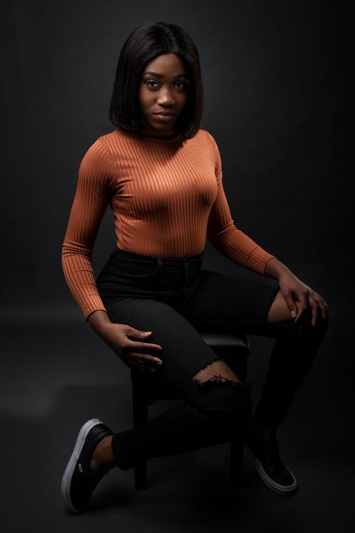 Free Woman Wearing Brown Sweater and Black Pants Stock Photo