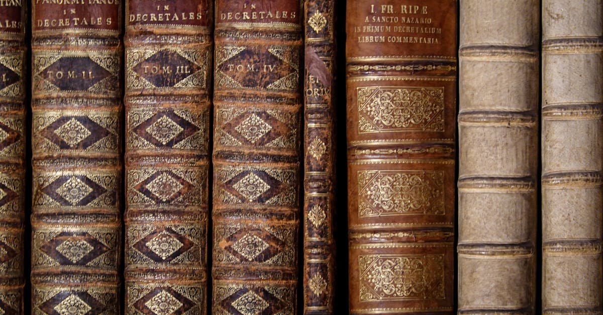 Detailed view of classic leather-bound books lined on a shelf.