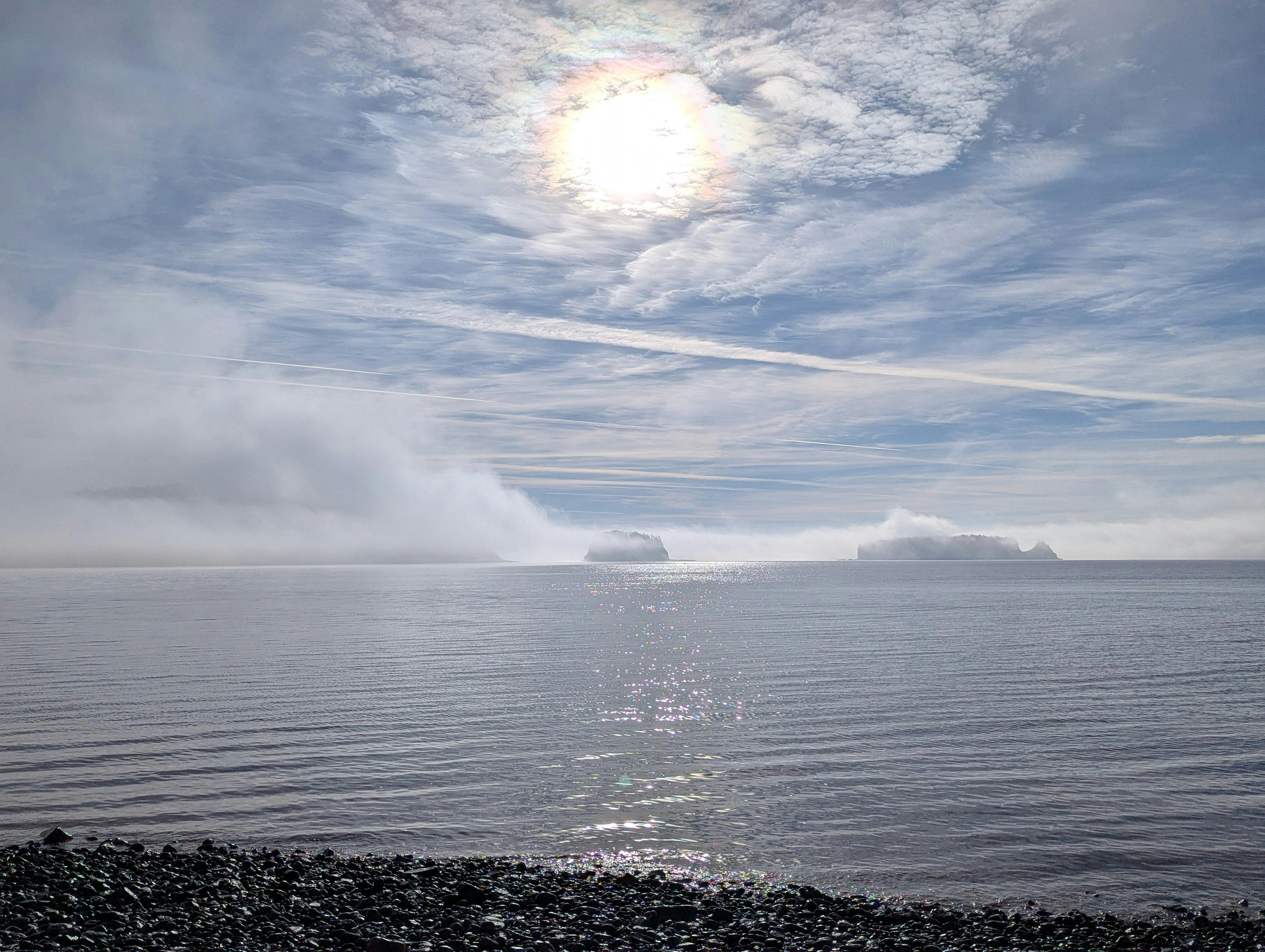 foggy coastal view with cloudy sky in canada