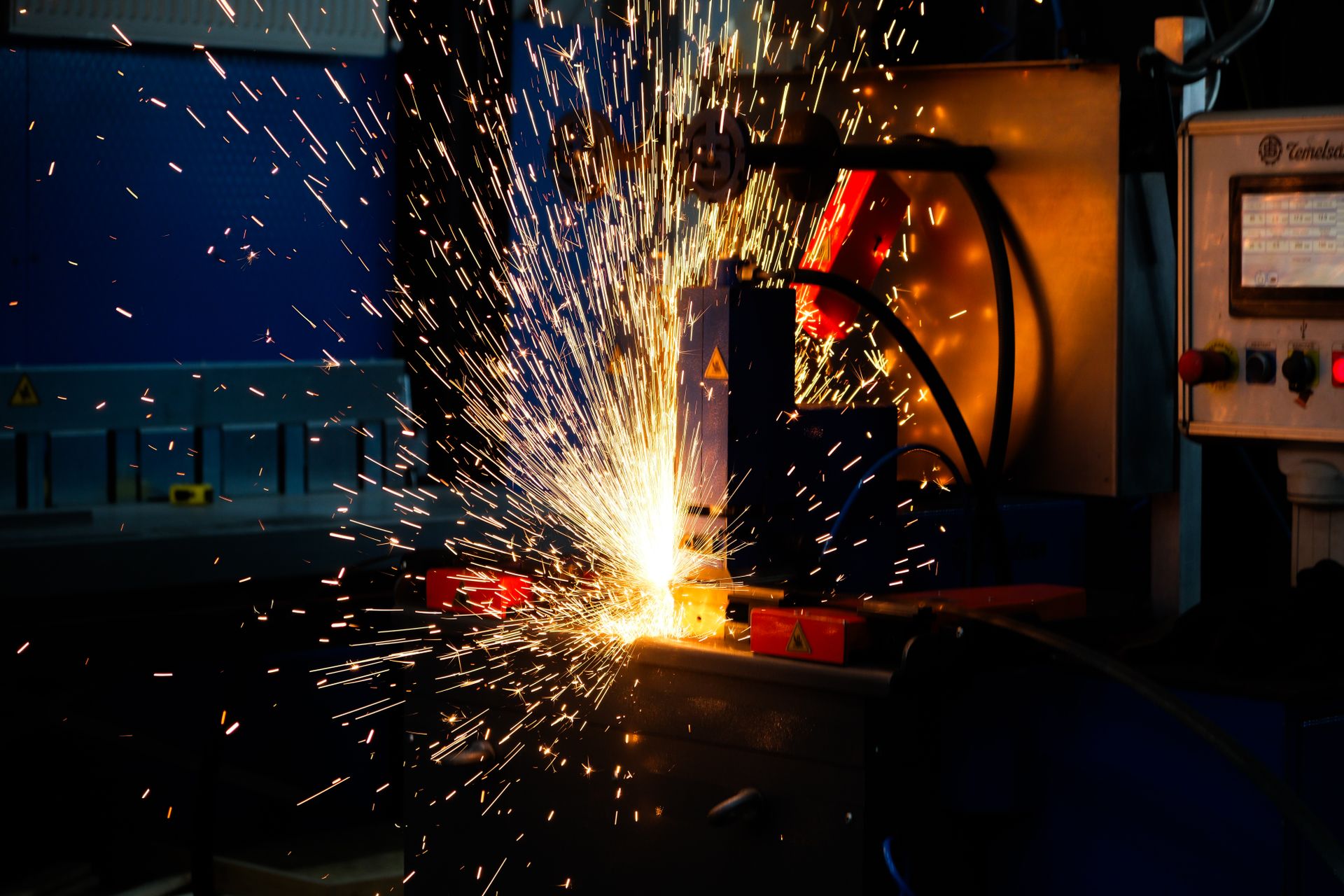 Welding sparks in an industrial fabrication shop.
