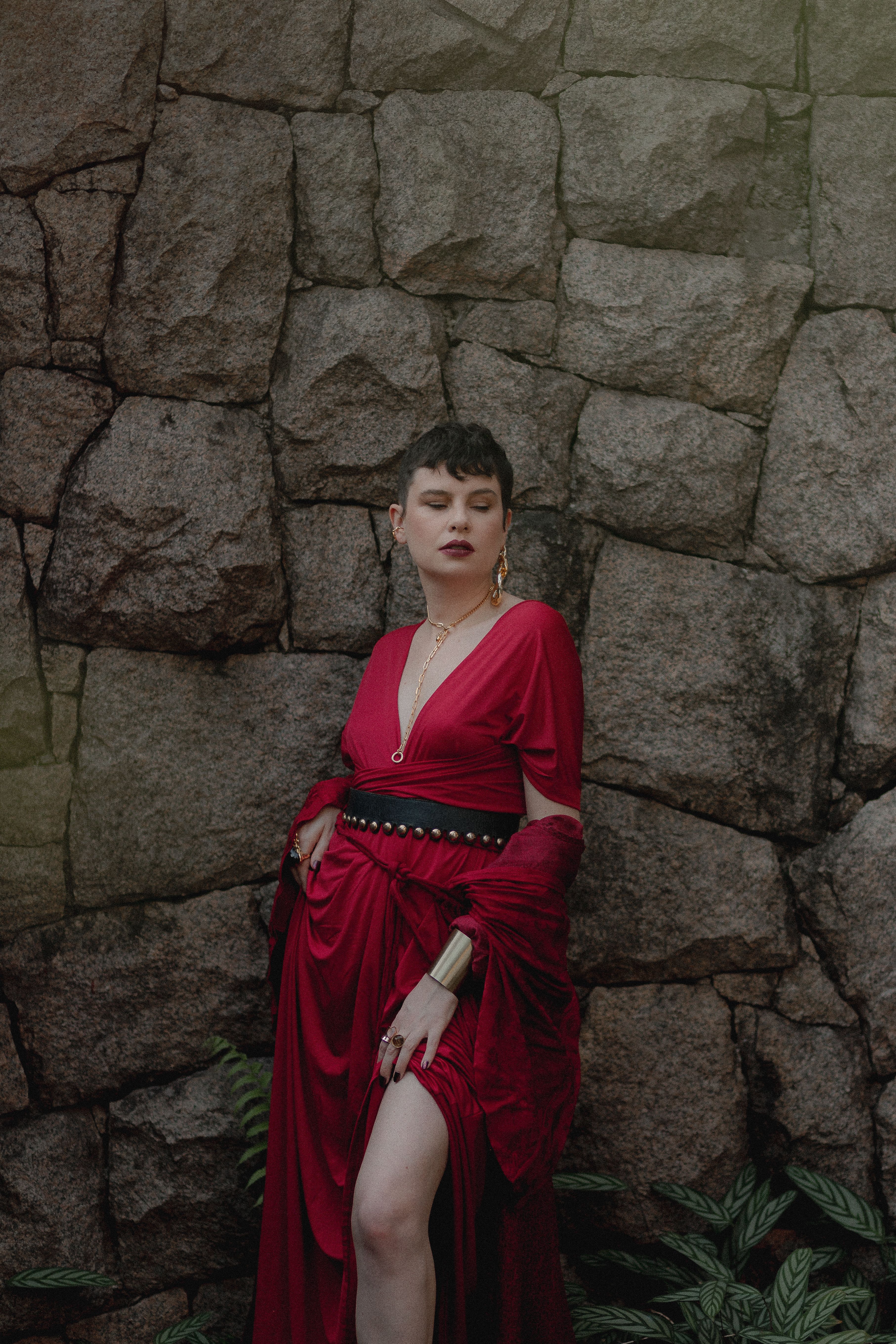 Elegant Woman in Red Dress by Stone Wall · Free Stock Photo