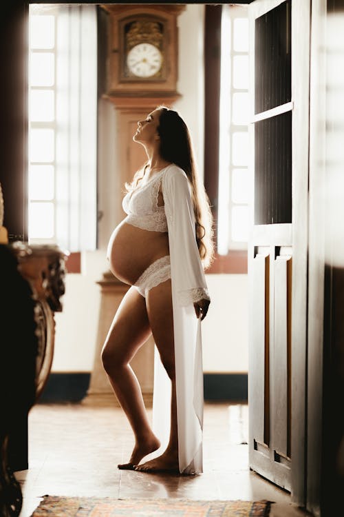 Free Pregnant Woman Wearing White Robe Stock Photo