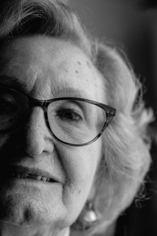Free Close-up black and white portrait of a stylish senior woman with glasses. Stock Photo