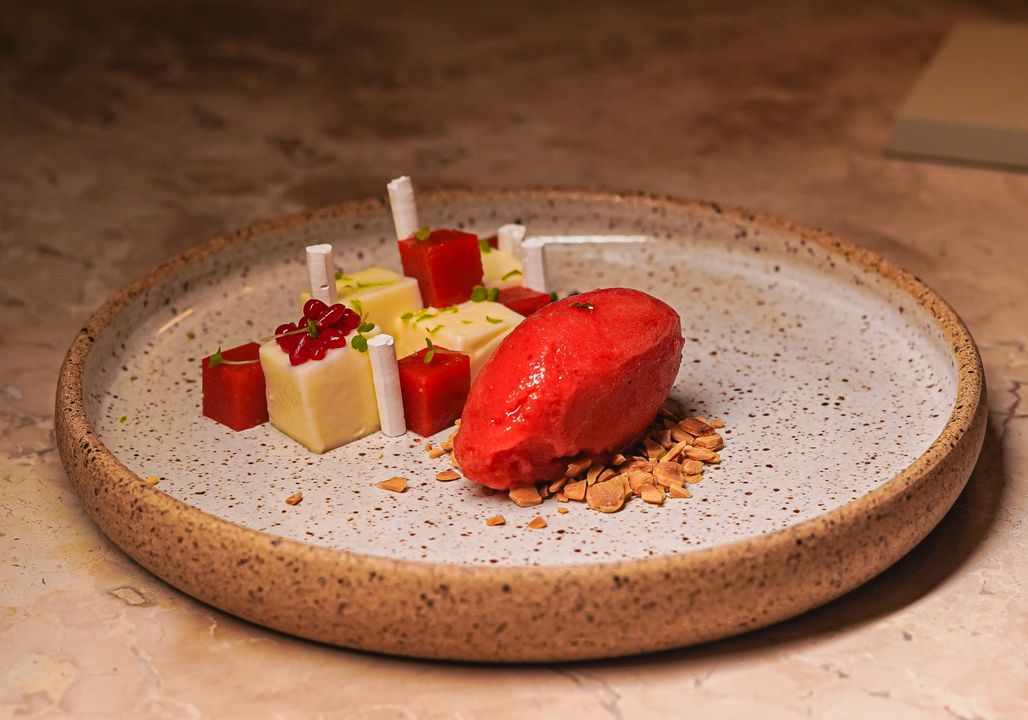 Entremet and Mousse Cakes: The French Technique Indian Pastry Chefs Are Adopting 1 A gourmet dessert plate with cubed fruit jelly, layered mousse, and sorbet, plated with precision