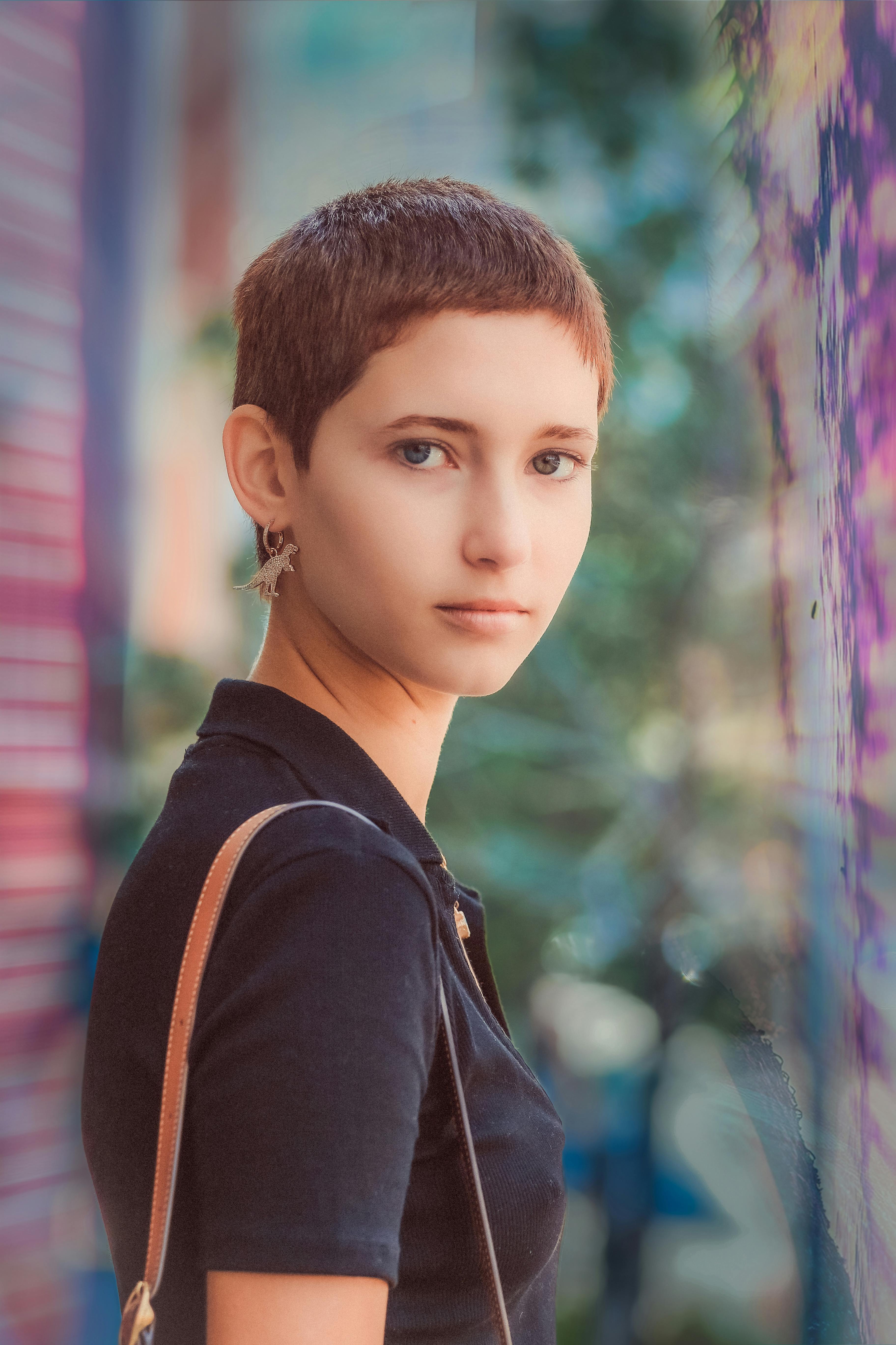 portrait of young woman with short hair outdoors