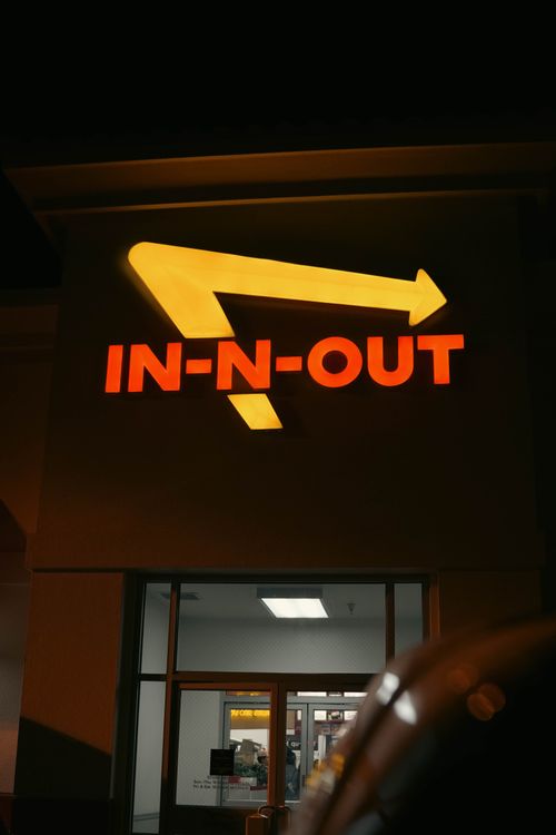 In N Out Sign In Illuminated In-N-Out Sign at Night Exterior · Free Stock Photo