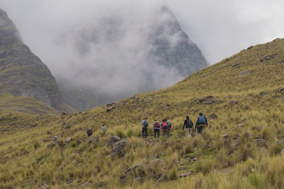 Breathtaking Day Tour to Santa Fe Island and Hidden Beach with Snorkeling and Fishing Review 2026 - Group hiking in the majestic Andes mountains near Cusco, Peru.