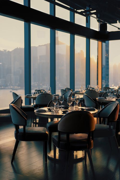 Elegant Dining Room with Skyline View at Sunset · Free Stock Photo