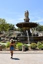 Tourist Enjoys La Rotonde Fountain in Aix-en-Provence
