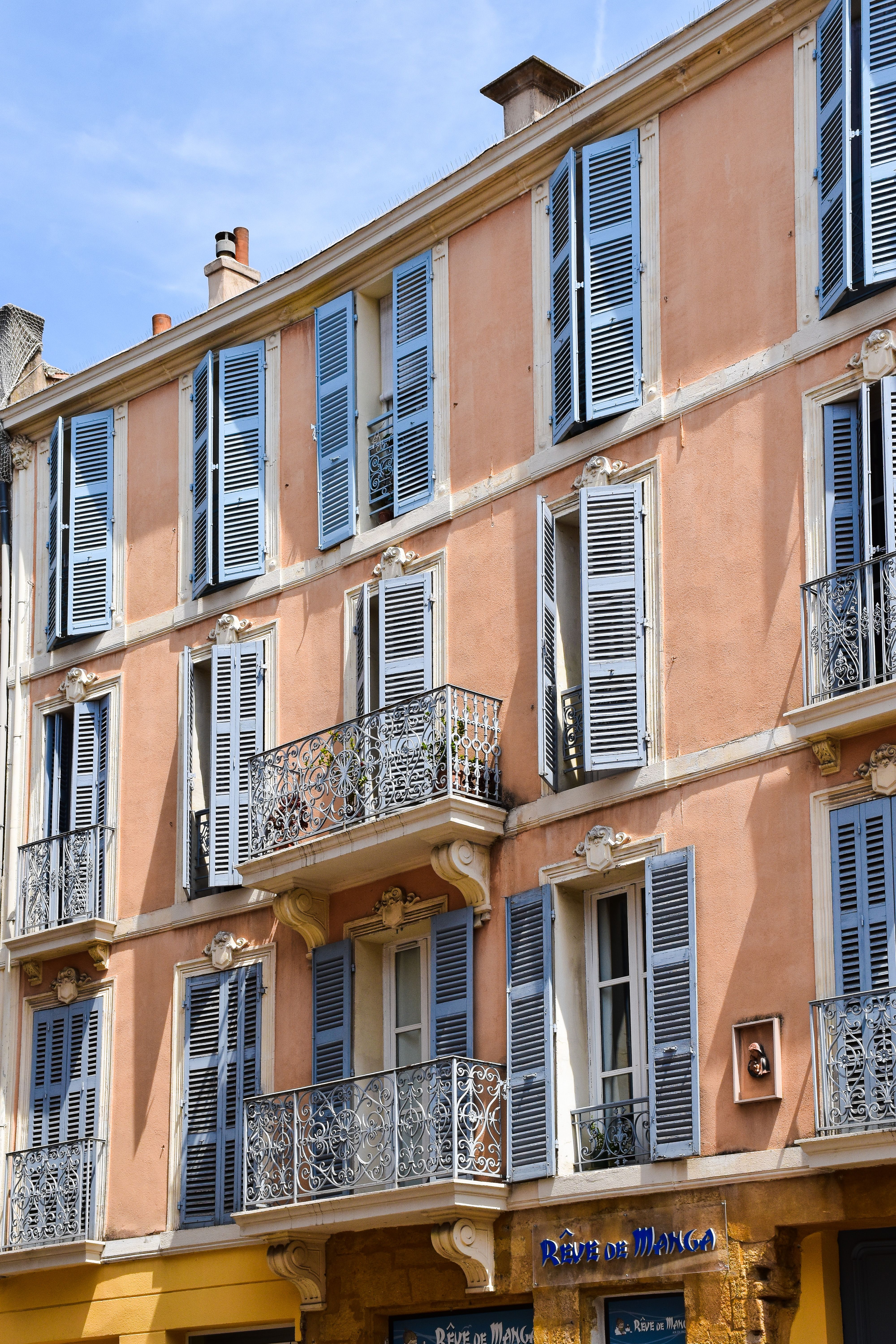 Charming facade with shutters in Aix-en-Provence, France.