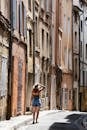 Woman Walking in Charming Aix-en-Provence Street