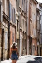 Woman Walking Down Quaint Street in Aix-en-Provence