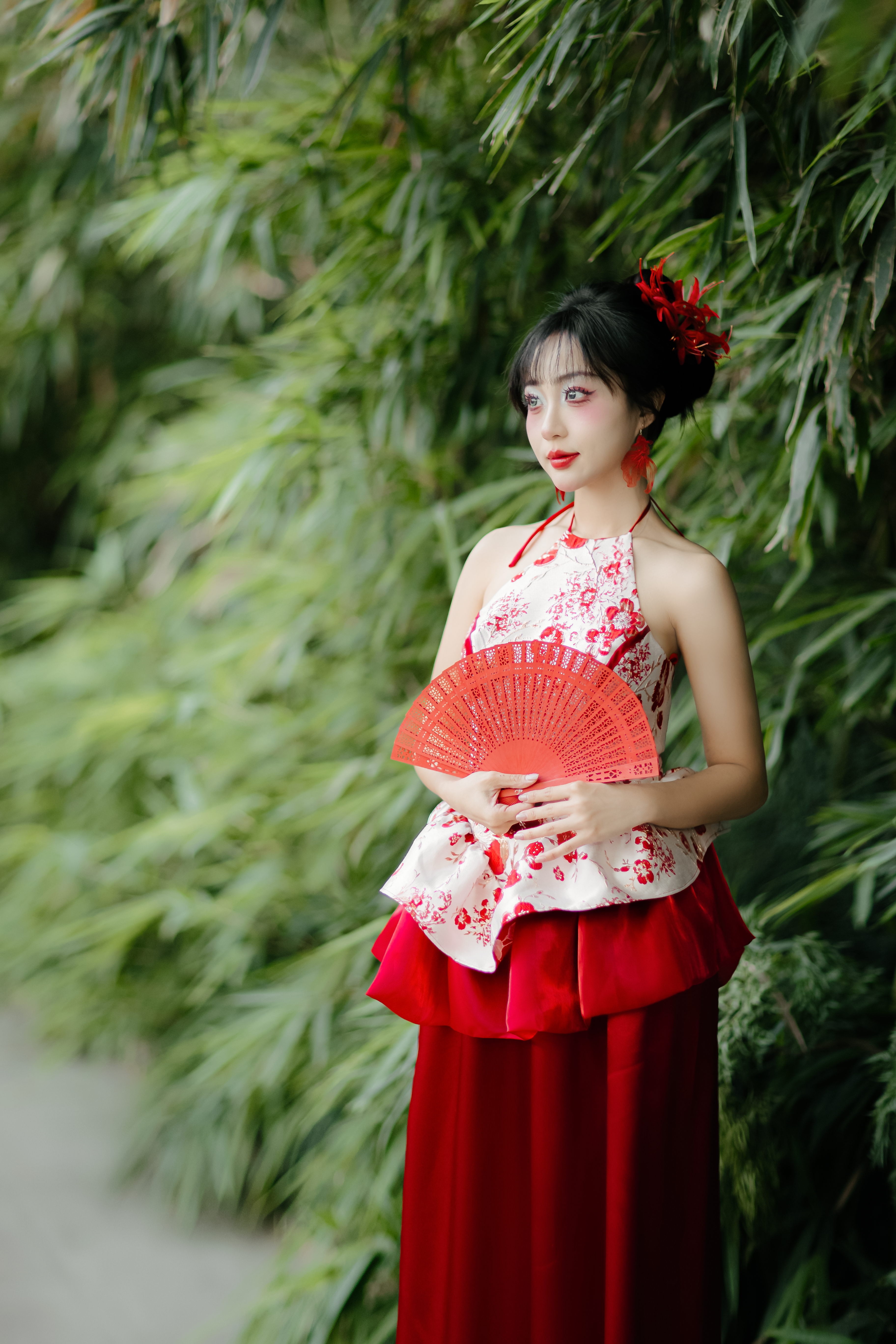 Elegant Woman in Red Dress with Fan Outdoors · Free Stock Photo
