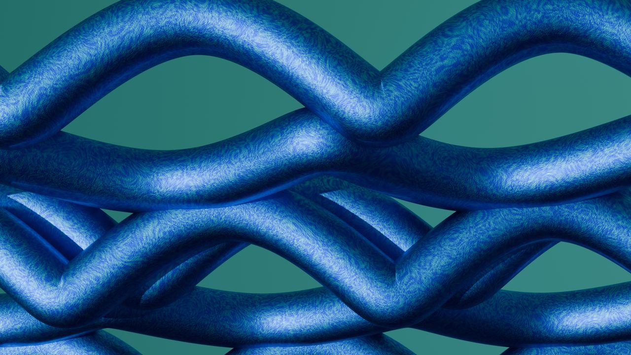 a close up of a woven blue abstract pattern against a green background