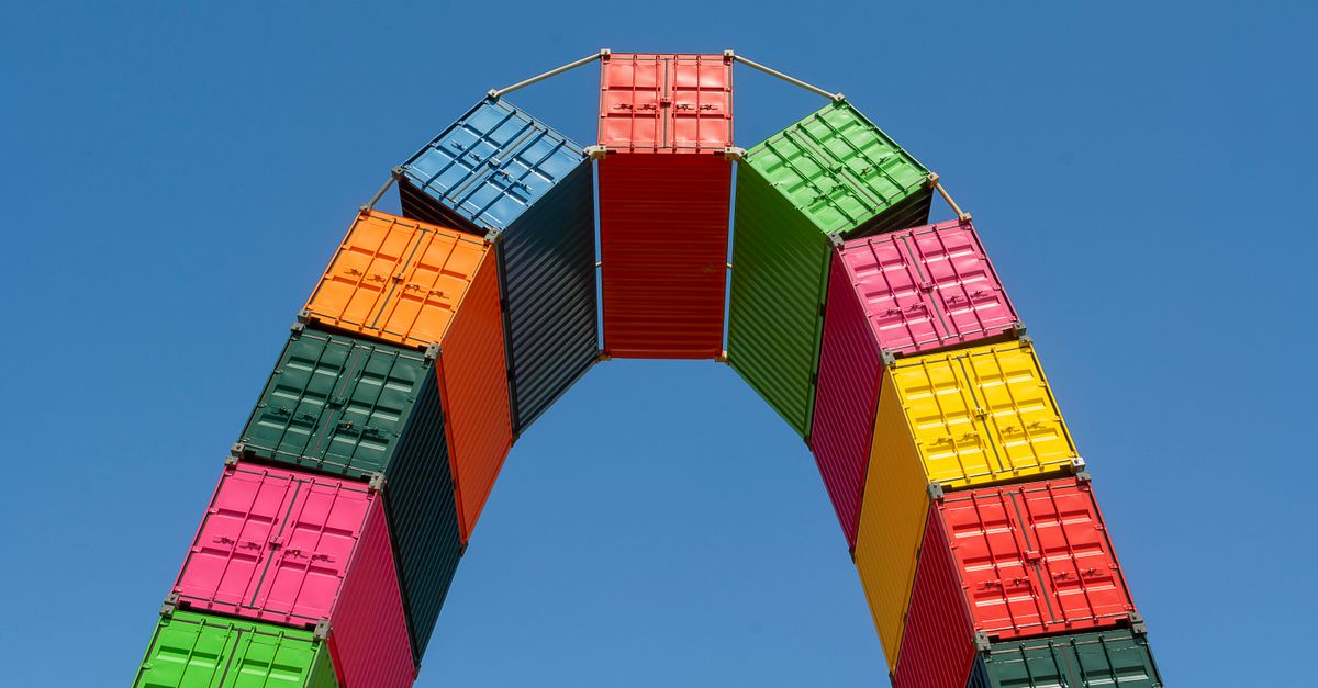 Container Arch Between Colorful Shipping Container Arch against Blue Sky · Free Stock Photo
