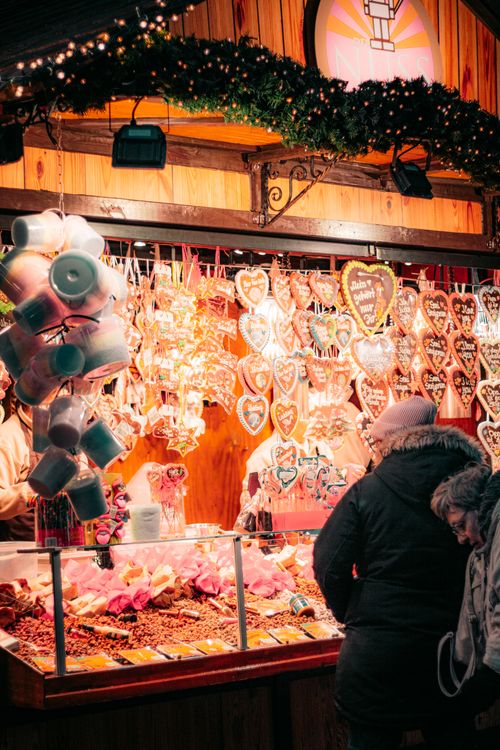 Free Cozy Christmas market in Hamburg with festive treats and heart-shaped gingerbread. Stock Photo