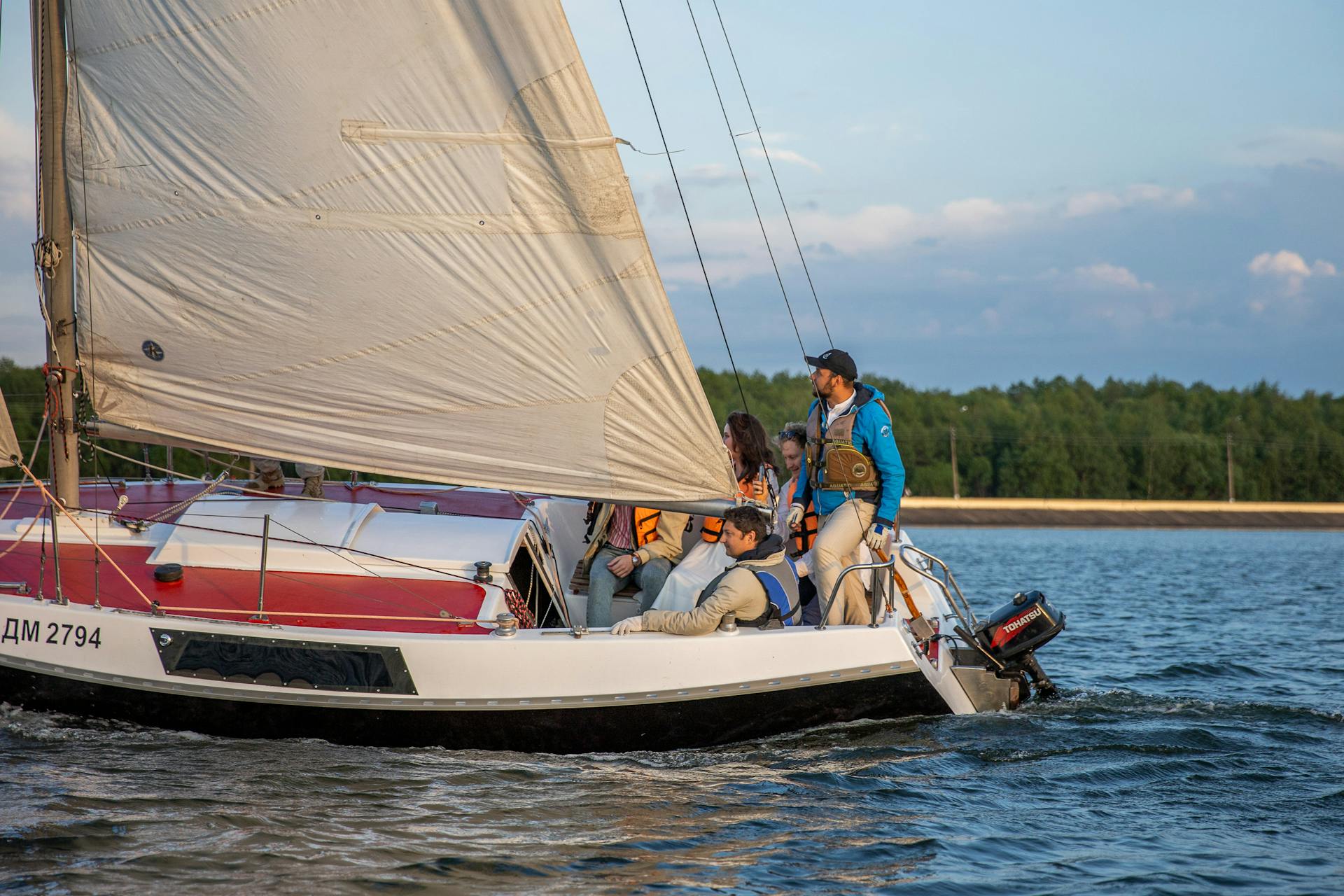 Enjoy a serene sailing journey in Минская область at sunset. Perfect for travel and adventure lovers.