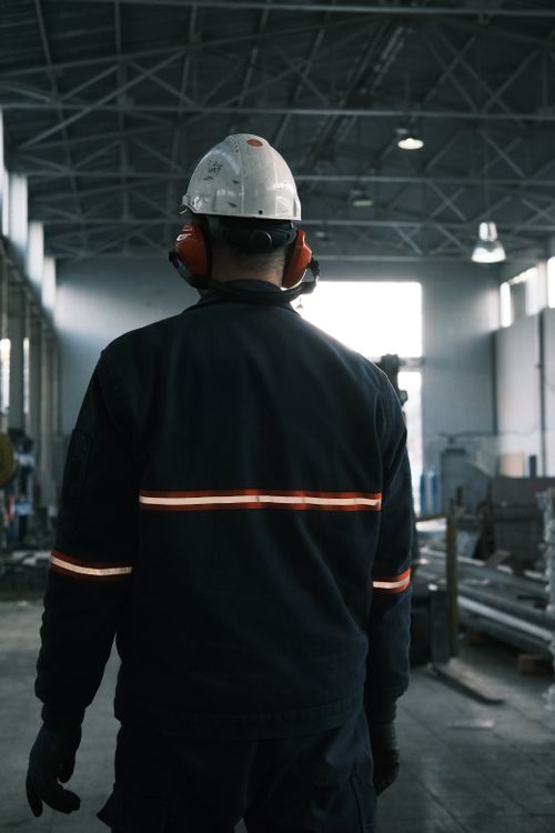 Worker in safety gear at the factory