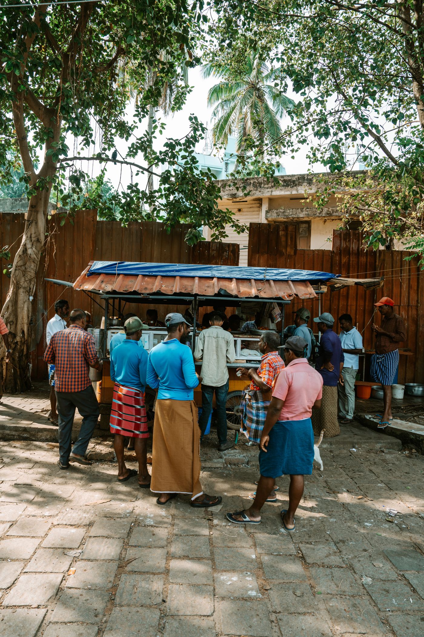 Temporary development photograph of an everyday food stall scene in Kochi, Kerala, not Mulki.