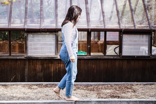 Free Photo Of Woman Walking On Wooden Rail Stock Photo