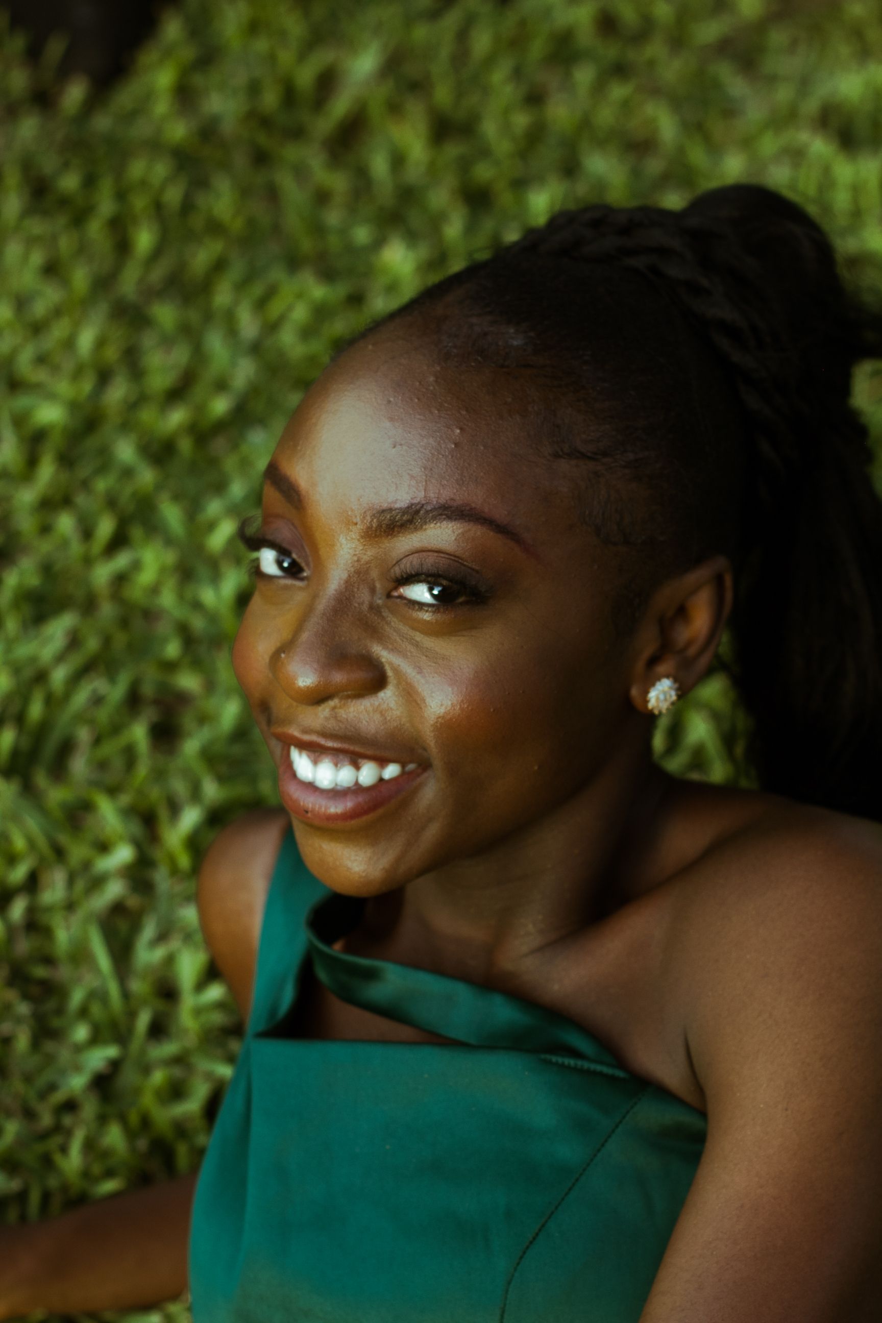 Smiling Woman in Green Dress Outdoors · Free Stock Photo
