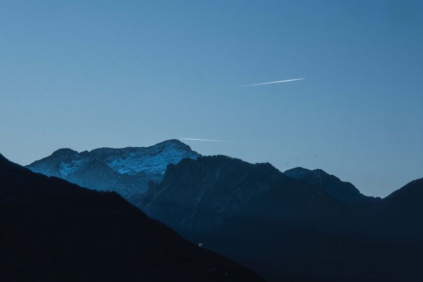 Twilight mountain ridge under a deep blue sky — photo by Francesco Ungaro on Pexels