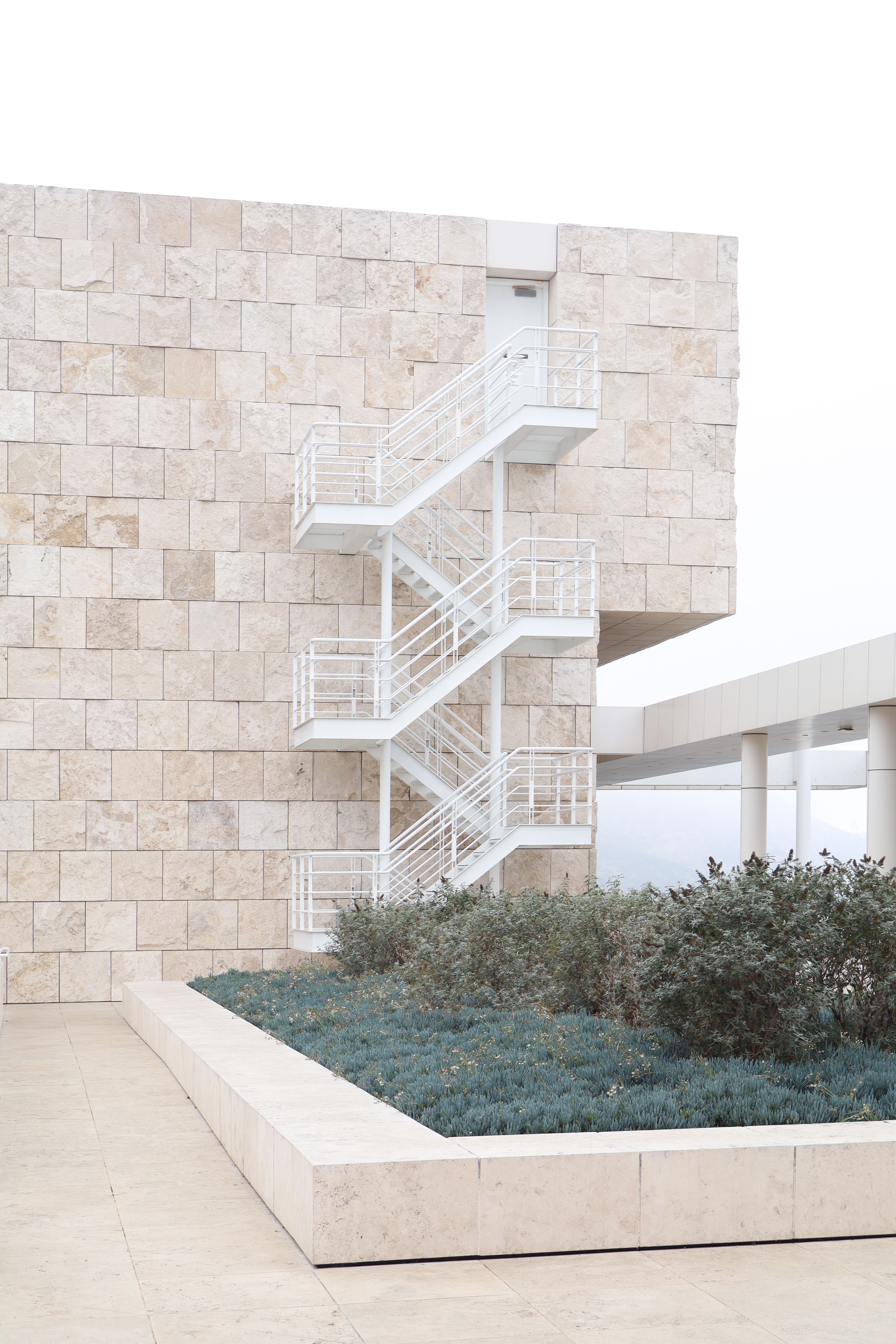 Minimalist design of a modern building with outdoor staircase in Los Angeles.