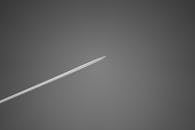 Monochrome Jet Plane Contrail in Sky