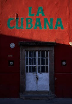 A colorful facade of a building in San Luis Potosí featuring a prominent 'La Cubana' sign above a rustic door.