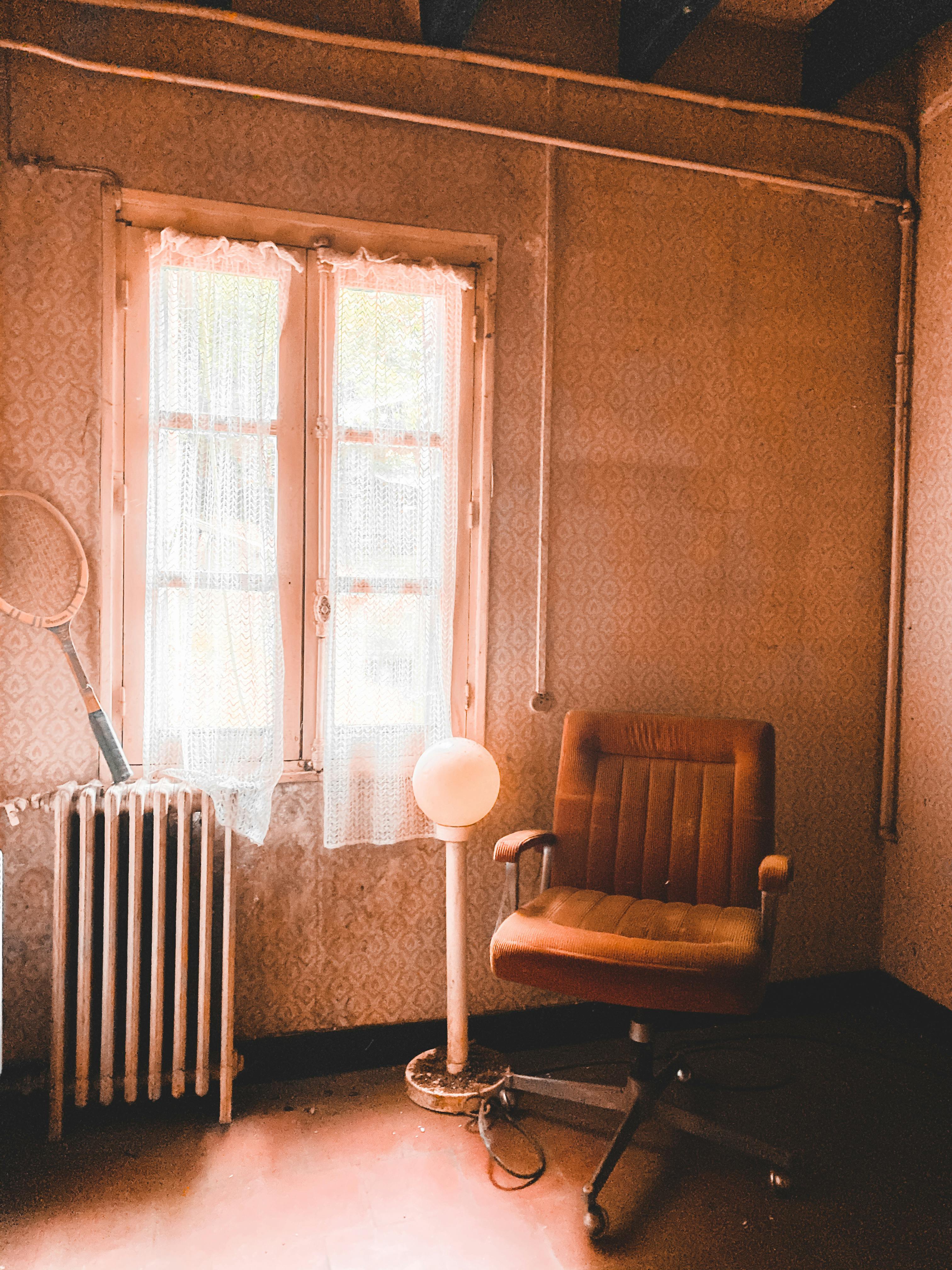Explore this vintage room in Tour, France, marked by warm lighting and faded elegance.