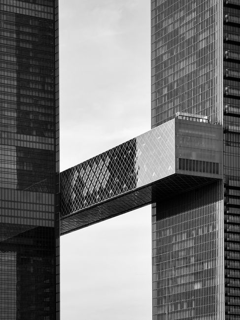 One Za'abeel, a striking architectural icon in Dubai, features twin towers connected by a sky bridge.