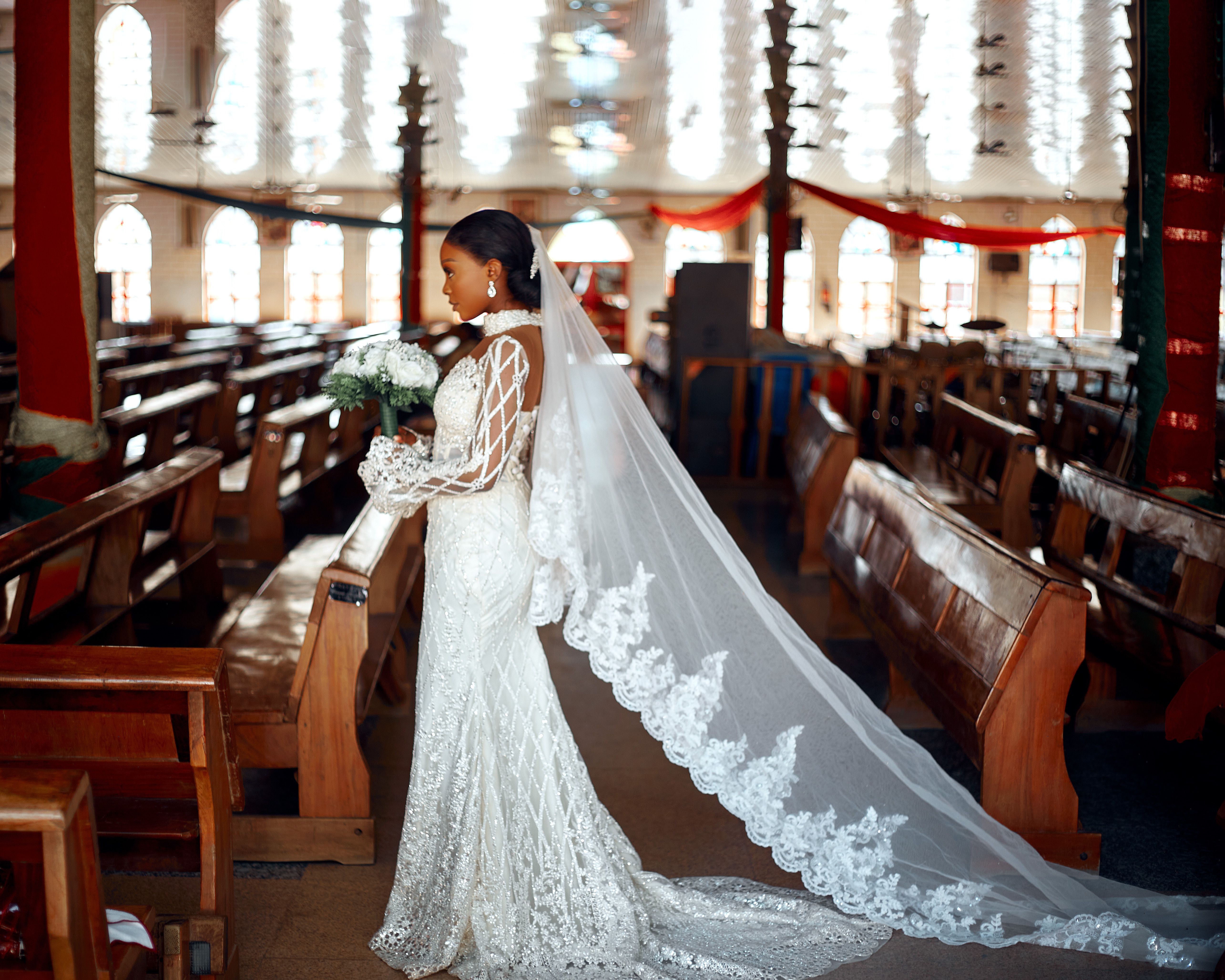 Elegant Bride in Church with Long Veil · Free Stock Photo