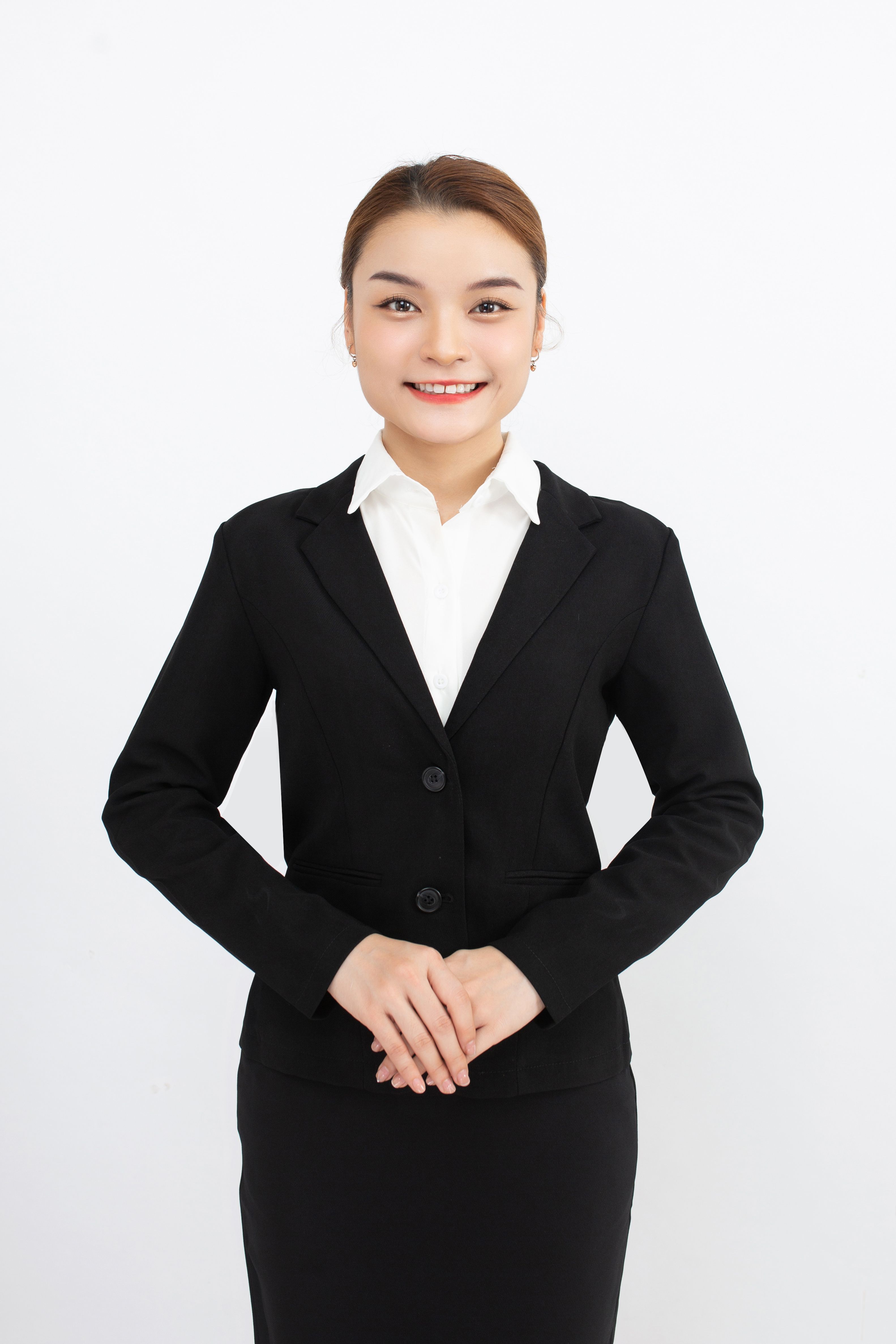 Portrait of a Woman in a Black Suit · Free Stock Photo