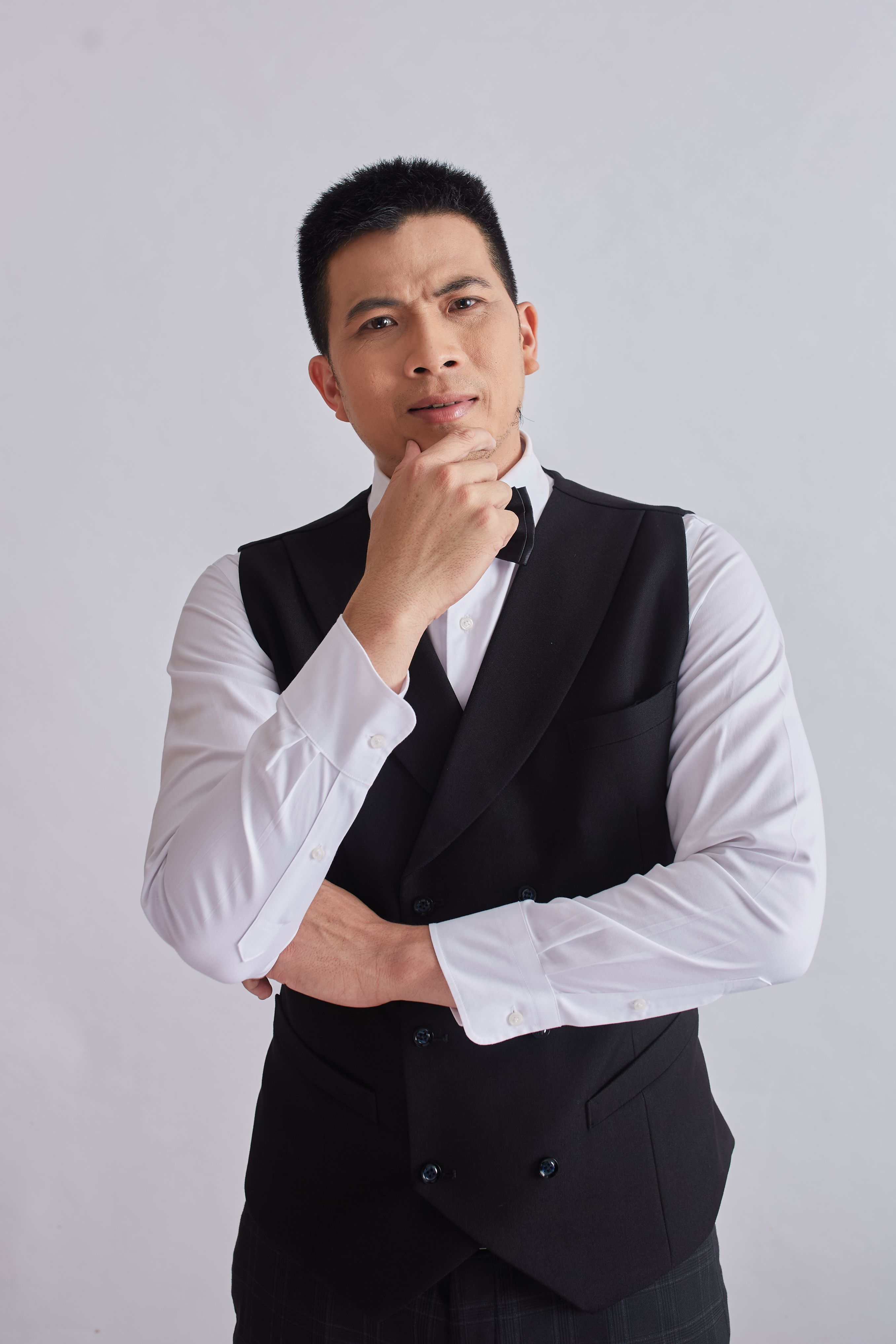 Portrait of a thoughtful man in formal business attire. Perfect for corporate themes.
