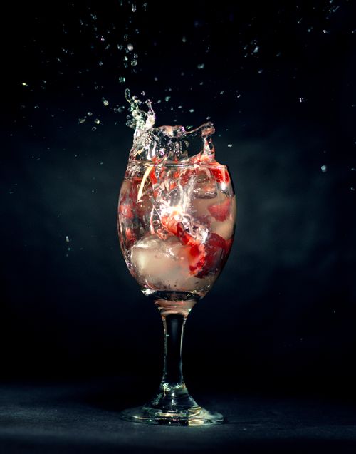 Free A vibrant splash captures a cocktail moment in a studio setting. Stock Photo