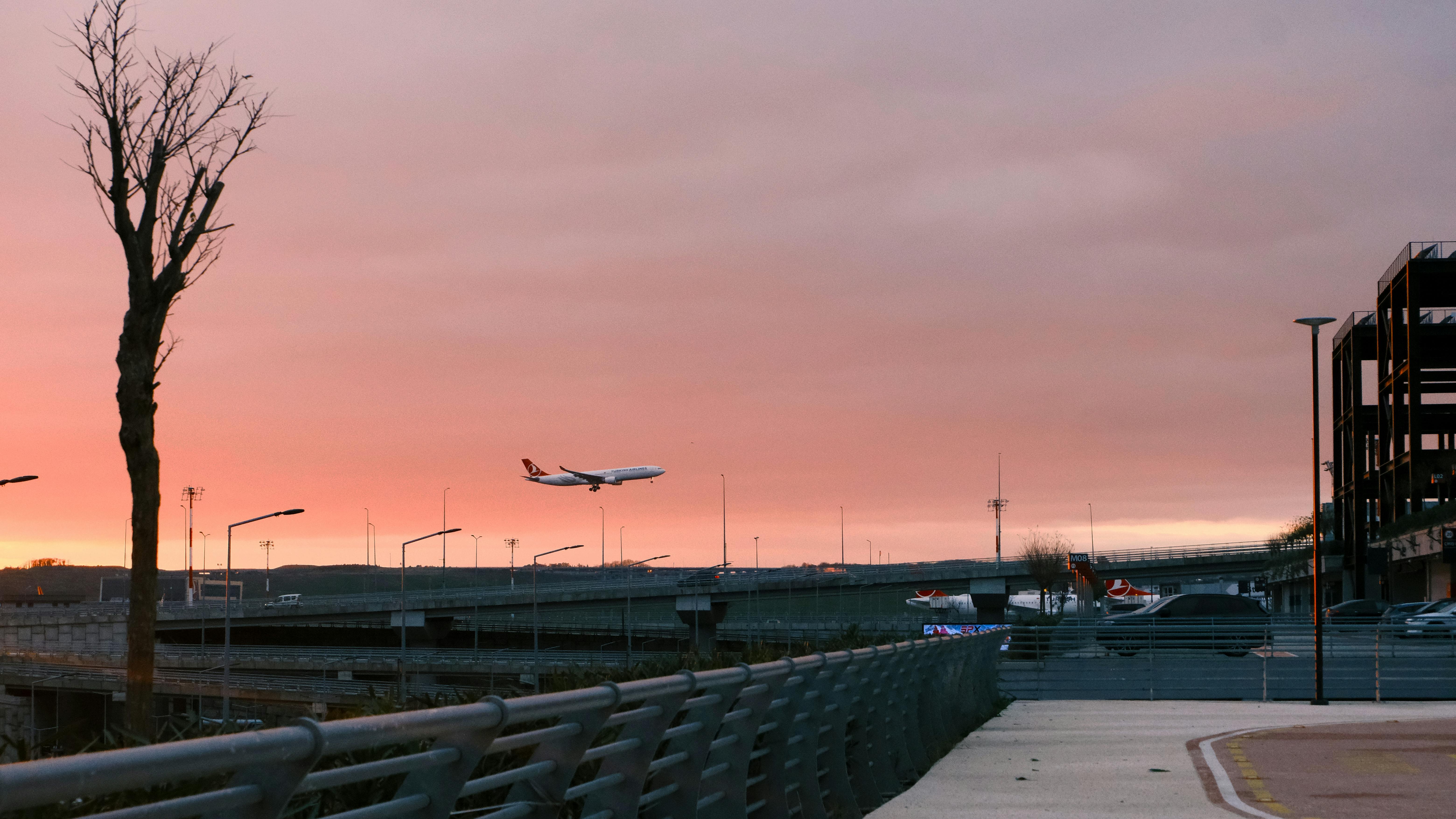 A Turkish Airlines plane takes off during a beautiful sunset in Istanbul, Türkiye.