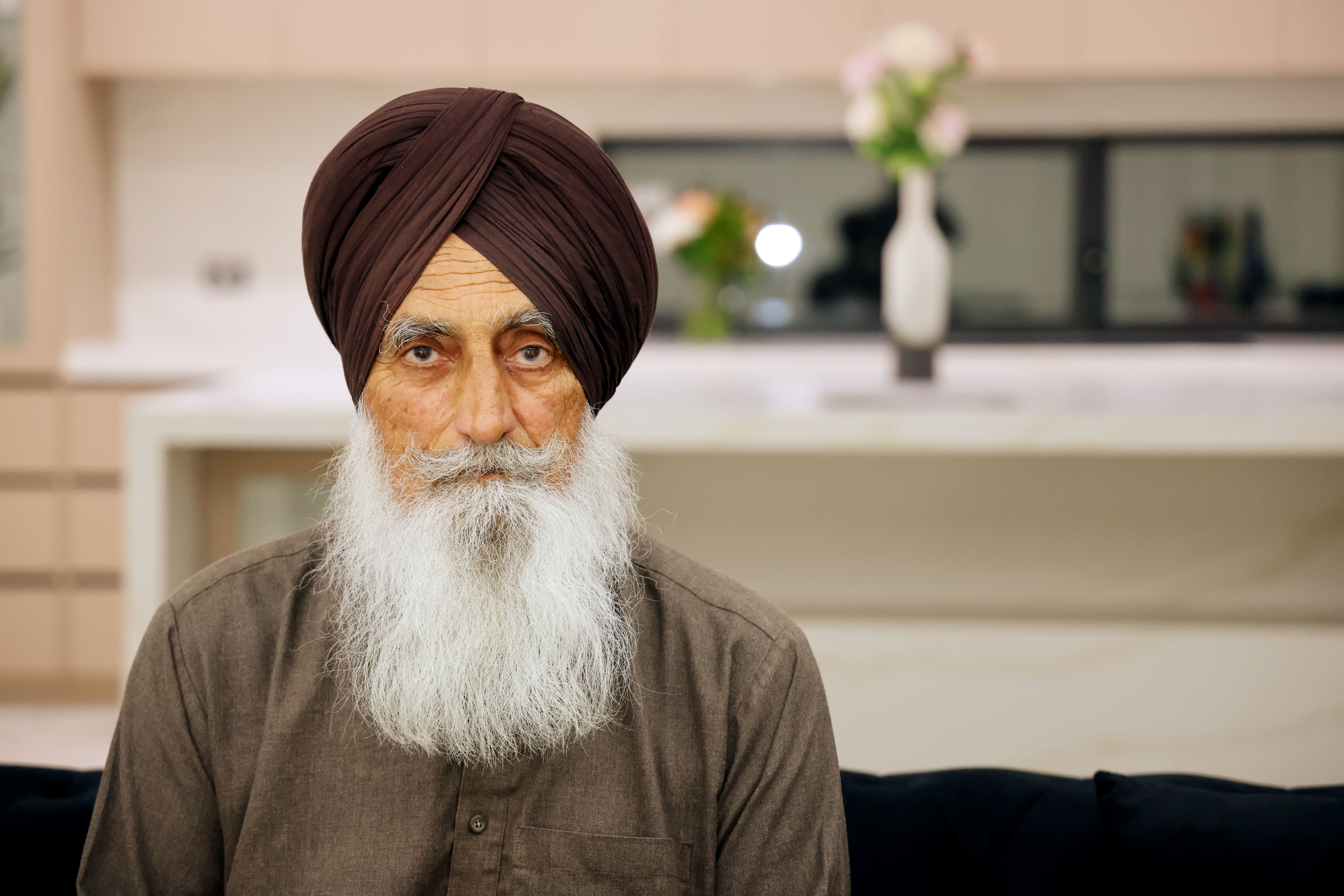 Elderly Man with Turban in Modern Living Room · Free Stock Photo