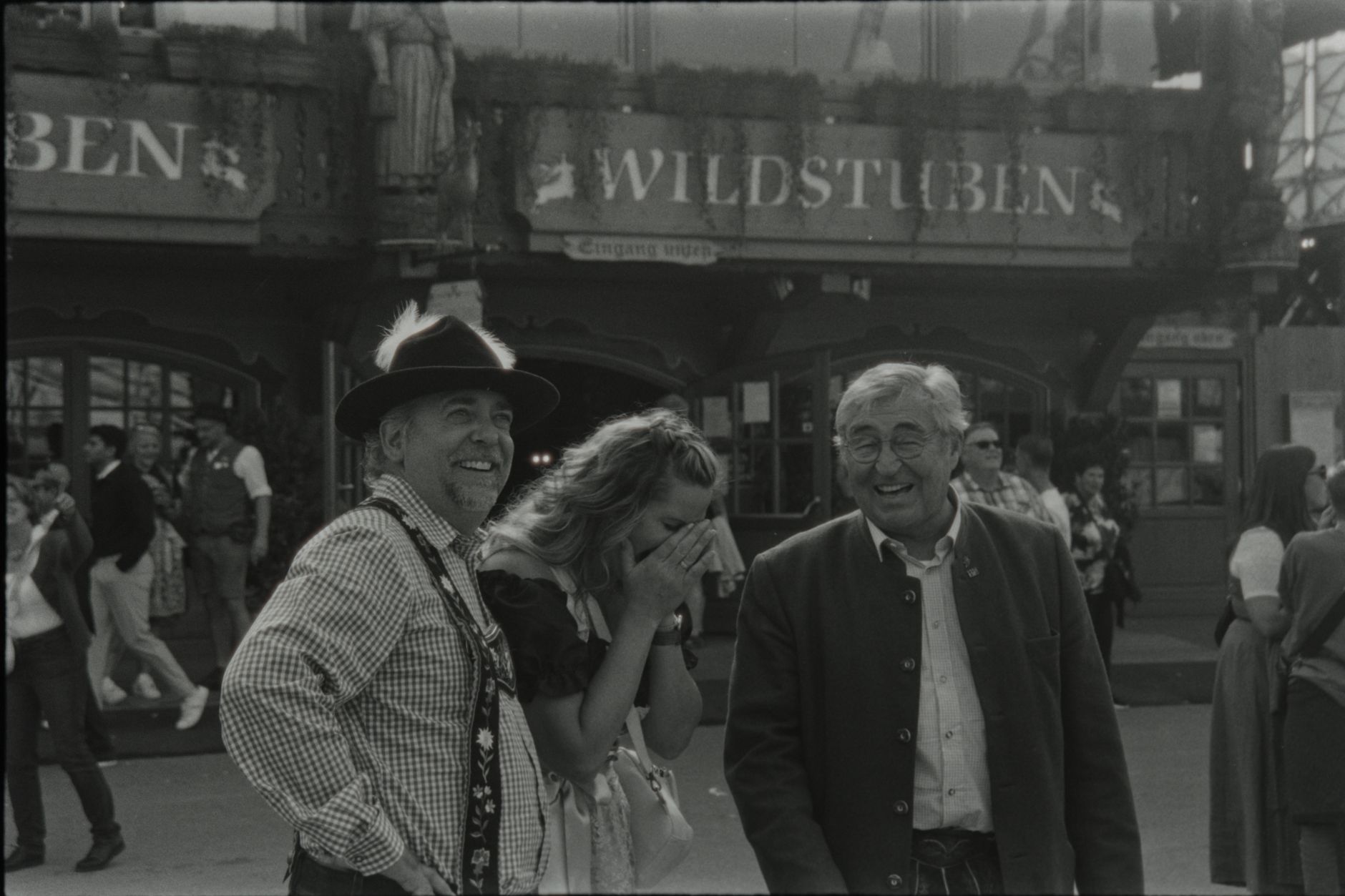 Three people enjoying Oktoberfest at Wildstuben, Germany.