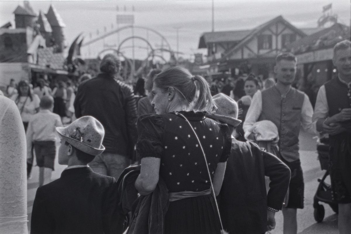 Guests in traditional Bavarian attire celebrating Oktoberfest