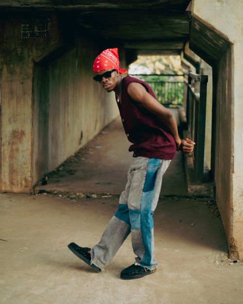 Free A trendy young man with sunglasses and bandana posing confidently in a tunnel. Stock Photo