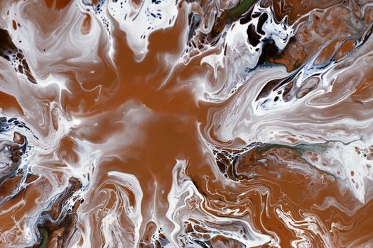 Dynamic abstract art with swirling brown and white paints creating a mesmerizing pattern.