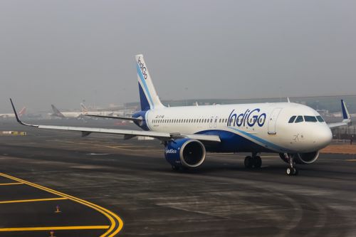 Free Close-up of IndiGo Airbus aircraft taxiing on the runway at a busy airport. Stock Photo