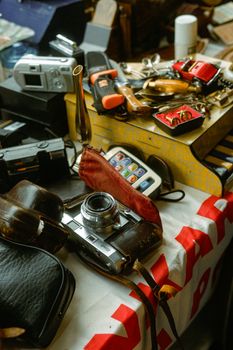 Table with vintage camera and retro gadgets, capturing nostalgic vibes.