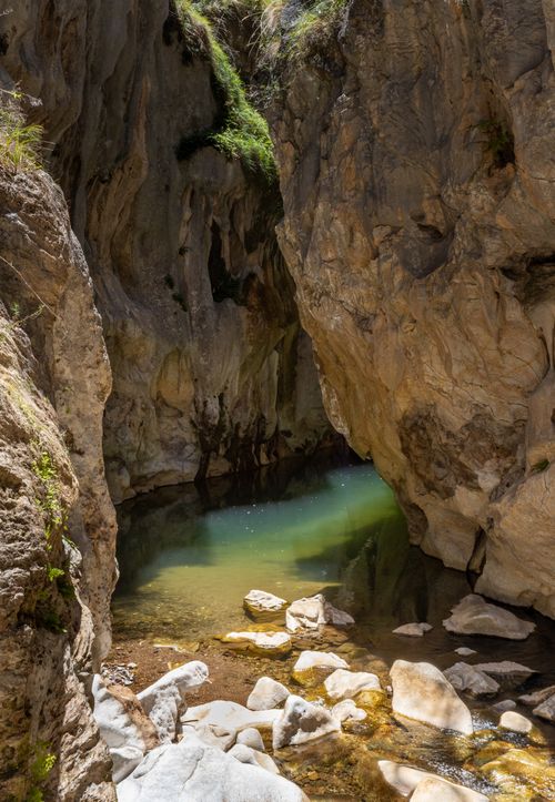 Free Explore a serene canyon with clear water and rugged rock formations, perfect for adventure and photography. Stock Photo