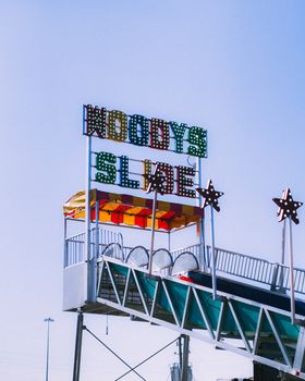 Vibrant carnival slide at a Houston fair, perfect for fun and entertainment imagery.