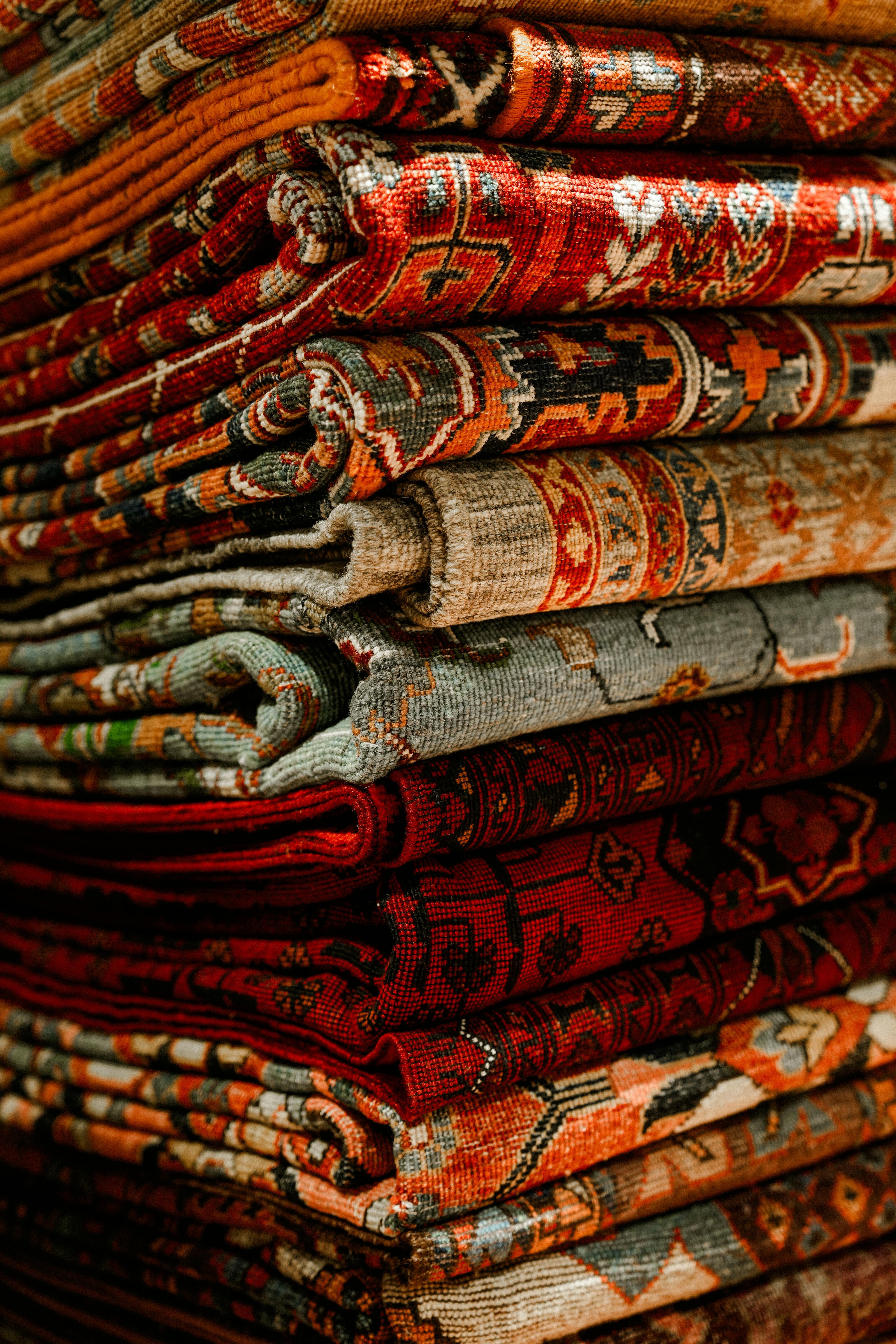 A colorful assortment of Persian rugs showcasing intricate designs and rich textures, perfect for interior decor.