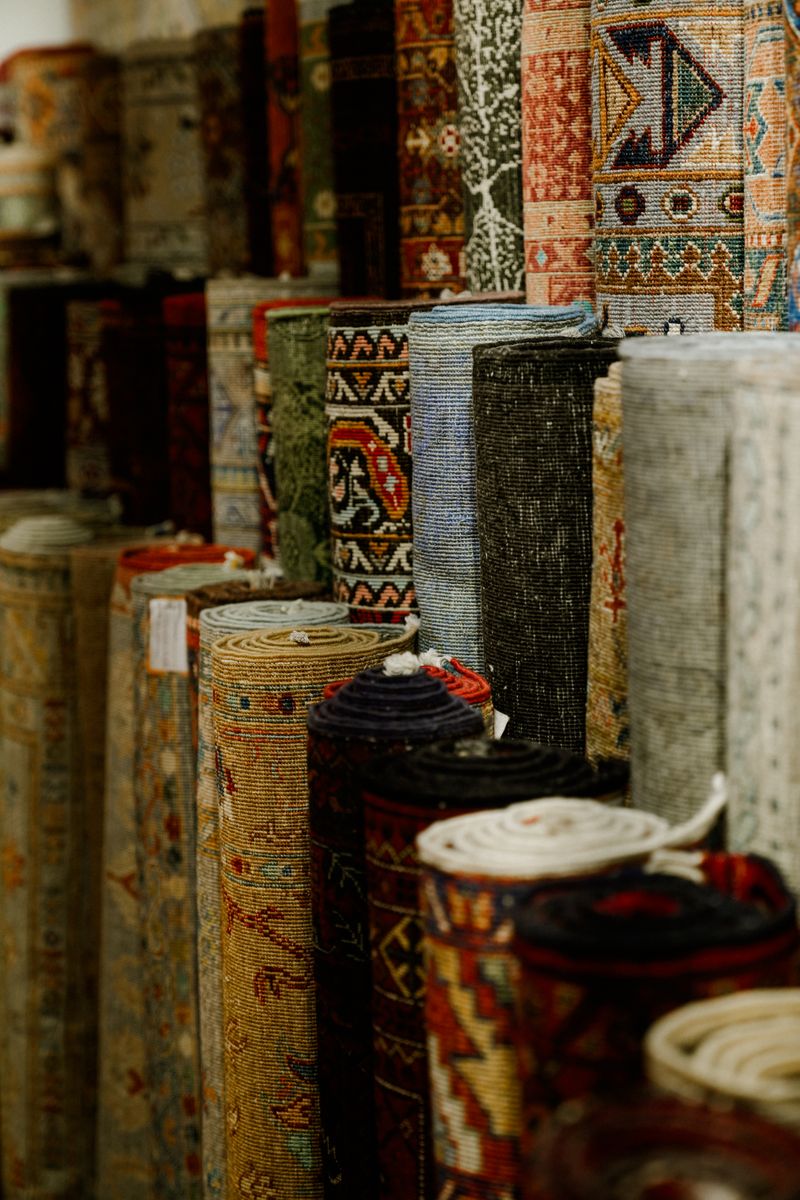 Carpet showroom displaying variety of rolled carpets