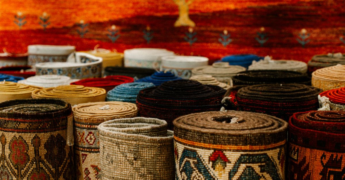 Market Rug Colorful Rolled Rugs in Traditional Market · Free Stock Photo