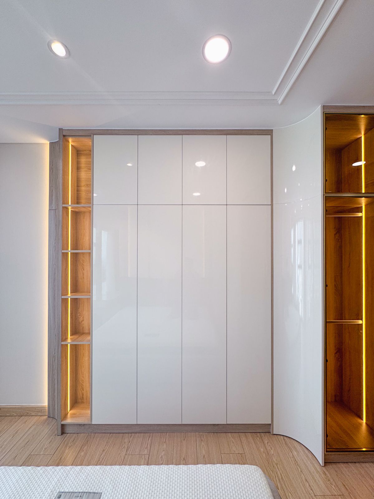 Modern white wardrobe with built-in lighting